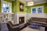 Lining up the fireplace, windows, and shelves helps tidy up the room