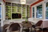 The open shelving has a contrasting paint color at the back to provide some contrast