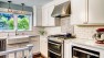 Classic Kitchen: Laurelhurst Kitchen Remodel – Kitchen with White Cabinets and Subway Tile