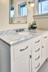 Bungalow West: Second-Floor Addition to a Bungalow – Hall bath marble top vanity cabinet.
