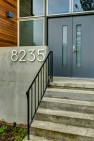Split Level Exterior Makeover: The Modern Split – Board & Vellum – New concrete accent wall at old concrete steps.