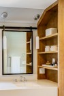 Custom built-in shelves under a sloped roof. – Remodel in a Tudor-style home: Morning Light Master – Board & Vellum