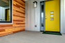 Ballard Locks Residence: Green Home Remodel – Bright yellow front door.