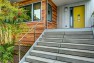 Ballard Locks Residence: Green Home Remodel – Natural wood siding paired with metal.