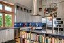 Ballard Locks Residence: Green Home Remodel – Storage for cookbooks in the kitchen island.