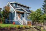 Blue house with a second story addition.