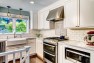 Classic Kitchen: Laurelhurst Kitchen Remodel – Kitchen with White Cabinets and Subway Tile