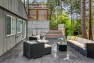 Split Level Exterior Makeover: The Modern Split – Board & Vellum – Seating area on the back patio.