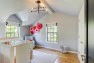 Child's bedroom with gabled ceiling. – Remodel in a Tudor-style home: Morning Light Master – Board & Vellum