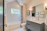 Hall bathroom with vaulted ceiling. – Remodel in a Tudor-style home: Morning Light Master – Board & Vellum