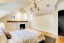 Master bedroom with wall of built-in storage. – Remodel in a Tudor-style home: Morning Light Master – Board & Vellum