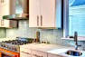 	Orange Is The New Knob: Eclectic Kitchen Design – IKEA Cabinets in a Custom Kitchen