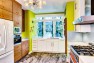 Orange Is The New Knob: Eclectic Kitchen Design – Pairing White and Wood Cabinets