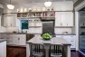 Seattle Box Remodel – Board & Vellum – Kitchen with cabinets all the way to the ceiling.