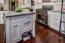 Seattle Box Remodel – Board & Vellum – Built-in niche for the dog bowls in the kitchen island cabinets.