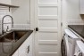 Seattle Box Remodel – Board & Vellum – Laundry room with large sink.