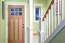 Urban Farmhouse – Entry with stained wood door and painted white trim.