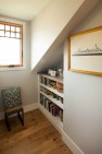 Under the Eaves – Second Story Remodel – Built-in bookshelves tucked under the eaves.