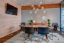 Capital Pacific – Commercial Office Design – Conference room with pendant lights.