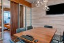 Capital Pacific – Commercial Office Design – Conference room with a bubble light chandelier.