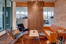 Capital Pacific – Commercial Office Design – Masculine look with leather and wood.