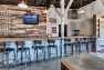 Lowercase Brewing Taproom – Salvaged wood from Boeing forms the backdrop of the bar.