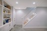 Opening up the basement stair makes the room feel larger. – Addition on Three Floors – Board & Vellum