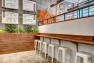 Oasis Tea Zone Capitol Hill – Bar seating with wood bar top. – Retail Café Design