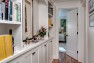 Built-in shelves and art display in the hallway. – Gut and Remodel of a 1960s-era Home – Sound Landing – Board & Vellum