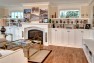 Built-in display shelves and cabinets in the living room. – Gut and Remodel of a 1960s-era Home – Sound Landing – Board & Vellum