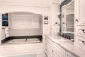 Alcove bathtub with arched opening. – Gut and Remodel of a 1960s-era Home – Sound Landing – Board & Vellum