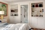 Master bedroom with built-in bookshelves and cabinets. – Gut and Remodel of a 1960s-era Home – Sound Landing – Board & Vellum