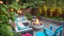 Outdoor living room with a gas fire pit. – Urban Yard at The Seattle Box – Board & Vellum