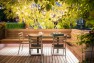 Outdoor dining area with banquette seating. – Urban Yard at The Seattle Box – Board & Vellum