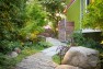 Garden path ends at a gate to the driveway. – Urban Yard at The Seattle Box – Board & Vellum