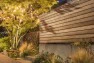 Wood slat fence over a concrete base. – Urban Yard at The Seattle Box – Board & Vellum