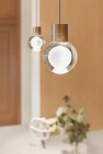 Crystal sphere pendant lights, in the Petite Condo Kitchen, by Board & Vellum.