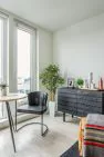 Interior design for the dining area staging of a model unit in an apartment building, the Lucille on Roosevelt.