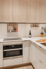 A remodeled small ADU kitchen, viewed from the interior.