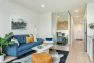 View of the living room towards the bedroom in a model unit apartment in the Lucille on Roosevelt, a new apartment building by Board & Vellum.