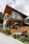 Plentiful glazing, a large shed roof, and warm wood tones give this home a Pacific Northwest feel. — Cloverdale House – Second Story Addition by Board & Vellum