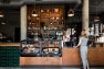 The point of sale counter at Armistice Coffee & Cocktails, a coffeeshop in the Lucille on Roosevelt. – Commercial Retail Design by Board & Vellum