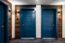 Blue painted doors at the unit entries in the corridor of the Lucille on Roosevelt.