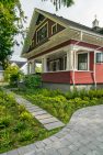 A classic Craftsman home with a large front porch with columns.