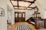 Classic wood details adorn the foyer in this classic Craftsman manor home.