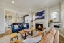 Living room in a Craftsman home with couches around a fireplace.