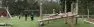 Kids play on log play structures at Westside Park in Redmond, Washington. Park refresh by Board & Vellum landscape architecture team.