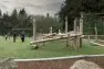 Kids play on log play structures at Westside Park in Redmond, Washington. Park refresh by Board & Vellum landscape architecture team.