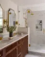 A primary bathroom’s vanity of stained alder and shower of marble and hand-crafted tile. Serene Modern Tudor — Board & Vellum