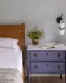 A bedroom with a soft violet side table. Serene Modern Tudor — Board & Vellum